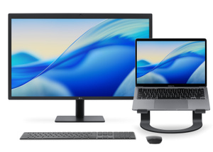 The stand raises a MacBook Pro to nearly the same height as an external monitor next to it, and also provides room for a freestanding keyboard and mouse.