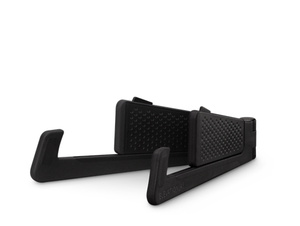 Angled front view of stand without iPhone, showing its premium composite and silicone construction with steel hinge.