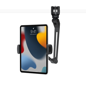 Angled view showing base replaced with adjustable clamp that’s attached to a shelf, with the arm extended below holding iPad.