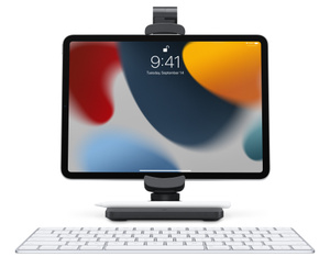 Front view showing the stand with arm folded down holding iPad in landscape mode behind a wireless keyboard for comfortable use as a workstation.