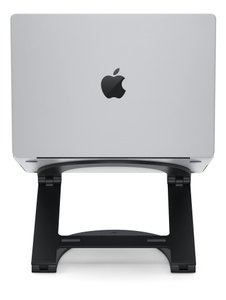 Rear view of Curve Flex Stand, in fully raised position, with open MacBook on top of it.