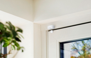 Eve Wireless Contact Sensors, mounted to the top of a door and the door casing, in the closed position.