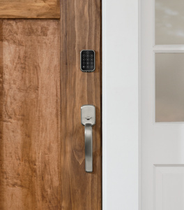 Yale Assure Lock 2 Plus keypad installed on the outside of a typical entryway door.