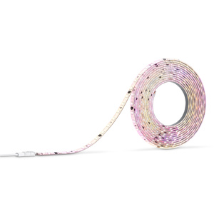 Nanoleaf Multicolor HD Lightstrip, illuminated in pink and yellow, coiled, power adapter connected