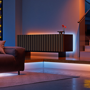 Nanoleaf Multicolor HD Lightstrip, illuminated, mounted behind a piece of furniture, in a darkened room setting