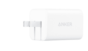 白色 Anker 50W USB-C 双端口壁式充电器，插脚展开伸出，中央有 Anker 标志。