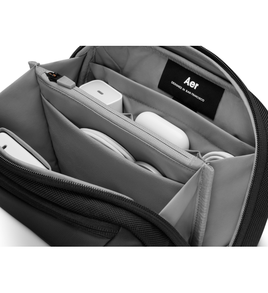 Aer Cable Kit 3, front and side exterior, black color, single zipper pouch at front, double zipper pouch at top, Aer logo tag at side