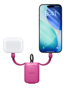 Twelve South Power Clip, front exterior, pink color, integrated USB-C cables extended at either side charging AirPods case at left and iPhone at right
