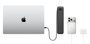 Belkin UltraCharge Pro 20K Power Bank at centre, top exterior, black colour, integrated cable charging MacBook on left, iPhone and AirPods case on right