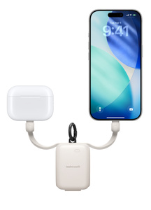 Twelve South Power Clip, front exterior, white color, integrated USB-C cables extended at either side charging AirPods case at left and iPhone at right