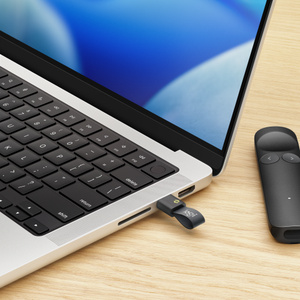 Logitech Spotlight 2 Presentation Remote, gray color, LogiBolt USB-C receiver connected to MacBook USB-C port