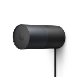 LG Outdoor Cam Plug-in, side exterior, graphite color (dark gray), horizontal cylindrical body, centered camera lens, black color wall mount, embedded power cord at bottom