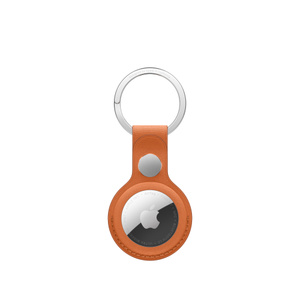 AirTag FineWoven Key Ring in fox orange, back, covers the entire outer edge of the AirTag, a circular cutout showing the Apple logo on an AirTag