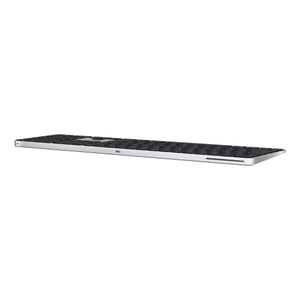 Magic Keyboard med Touch ID og numeriske taster vist bagfra, med afbryderknap, USB-C-port til opladning, sorte taster, sølvfarvet aluminiumstruktur og rund Touch ID-sensor