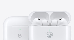 AirPods: AirPods 4 Charging Case, closed, rock on hand sign emoji engraved on front exterior; AirPods Pro 3 Charging Case, open, wireless headphones inside, star-struck face emoji engraved on front exterior