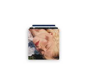 Apple Music: A stack of album covers with Girl's Just Flying by Maisie Peters on top