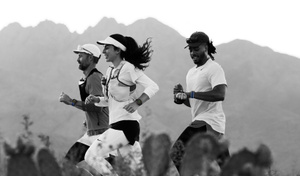 Runners on a desert trail track their workouts on Apple Watch Ultra 3