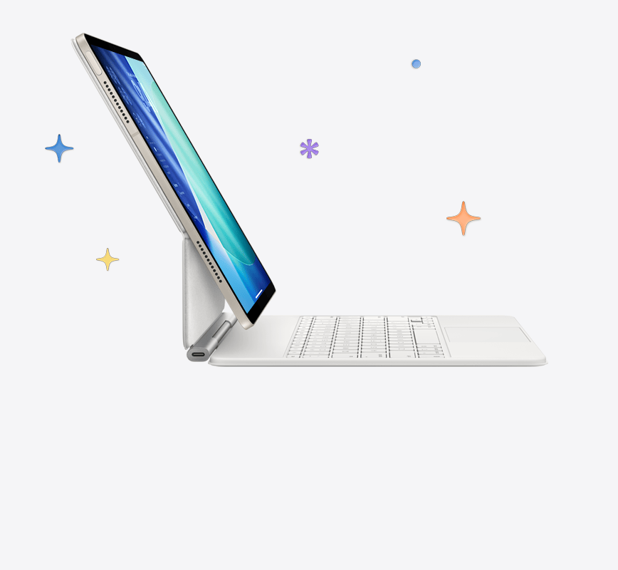 Csillagfény iPad Air fehér Magic Keyboardhoz rögzítve, a háttérben színes csillagokkal és pöttyökkel