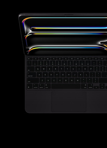 iPad Pro attached to Magic Keyboard, Black, black keys with white text, inverted T arrow keys, function key row, built-in trackpad