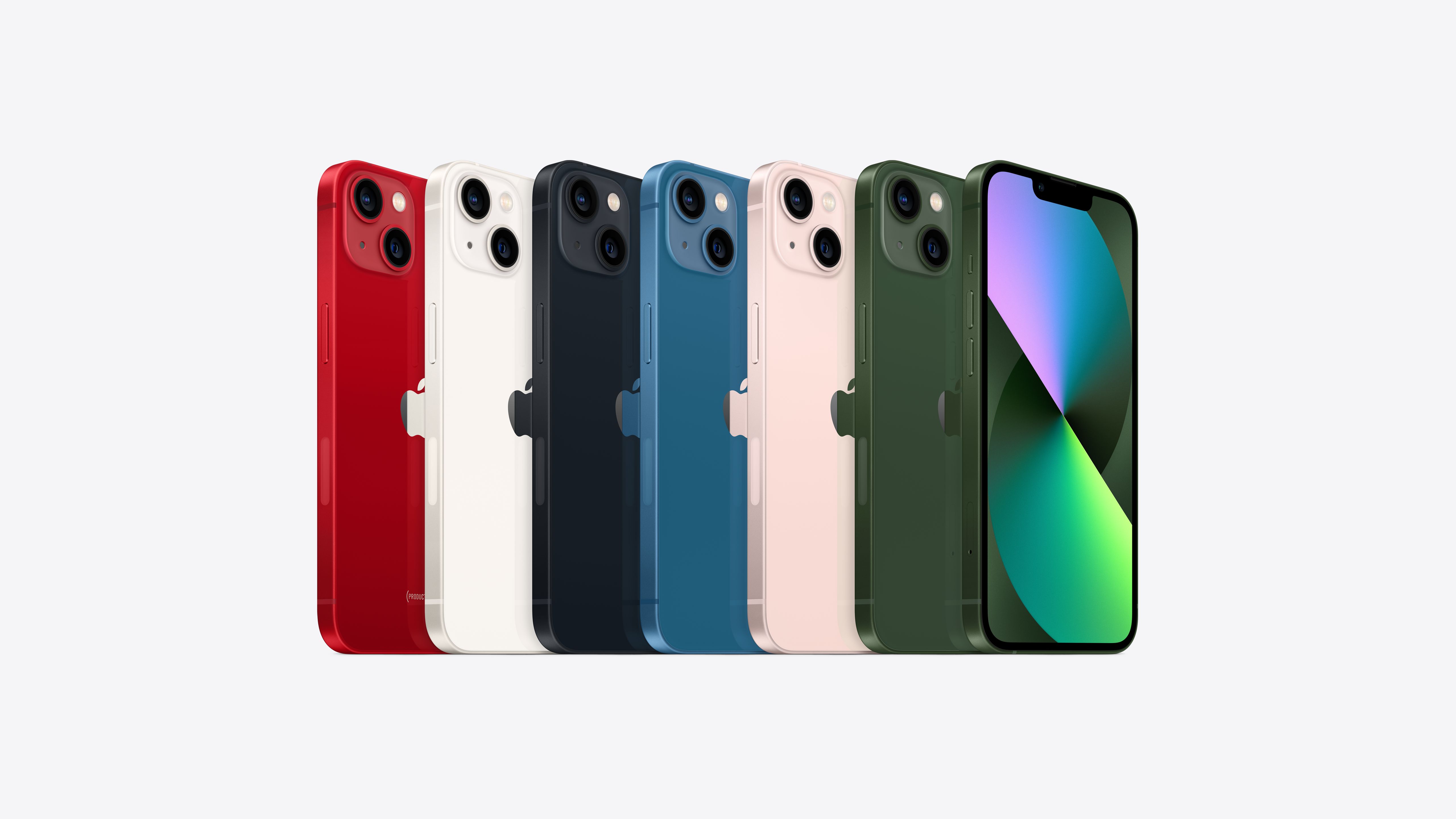 Angled view of all six colors of iPhone 13 including (PRODUCT)RED, starlight, midnight, blue, pink, and green, plus an angled front view in green.