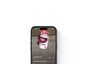 화면에 Apple Music 앱이 열려 있는 iPhone. 전체 화면 앨범 아트워크와 재생 제어 기능이 보입니다.