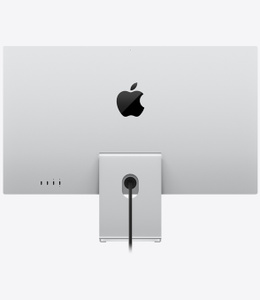 Studio Display, back exterior, silver color, stand mounted at bottom below centered black glossy Apple logo, two Thunderbolt 5 ports and two USB-C ports on lower-left side, power port centered at bottom with cable cutout in stand, display connected to angled tilt-adjustable stand, power cord attached