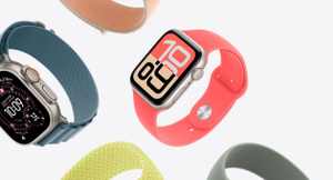 Apple Watch models: Apple Watch, starlight aluminum case, coral pink Sport Band, colorblock watch face with large numerals; Apple Watch Ultra 2, natural titanium case, teal Trail Loop band, Wayfinder watch face; additional bands: sage green Sport Band, yellow braided Solo Loop, blush pink band