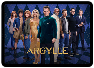 Argylle on Apple TV+, on an iPad screen, standing in a V formation against an argyle backdrop, from front to back, Henry Cavill, Dua Lipa, Samuel L. Jackson, Bryce Dallas Howard, Sam Rockwell, Ariana DeBose, John Cena, Catherine O’Hara, Bryan Cranston