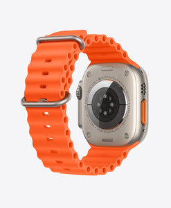 Back of Apple Watch Ultra Titanium Case with Orange Ocean Band, tubular fluoroelastomer rubber with titanium buckle