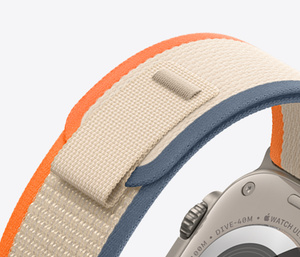 Exterior of Orange and Beige Trail Loop band, soft nylon weave with pull tab closure
