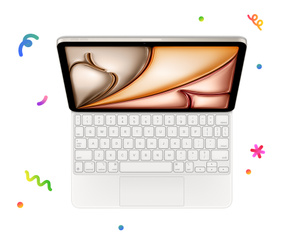iPad attached to Magic Keyboard, surrounded with multi-coloured confetti