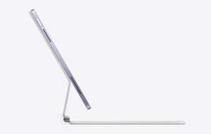 Side angled view of iPad Air attached to Magic Keyboard showing the floating cantilever design.