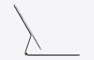 Side angled view of iPad Pro attached to Magic Keyboard showing the floating cantilever design.