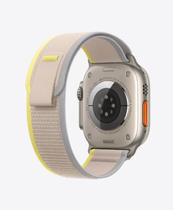 Back of Apple Watch Ultra Titanium Case with Yellow and Beige Trail Loop strap, soft nylon weave with pull tab closure
