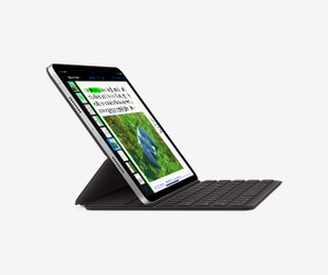 Side profile view of iPad Pro and black Magic Keyboard angled for typing and viewing.